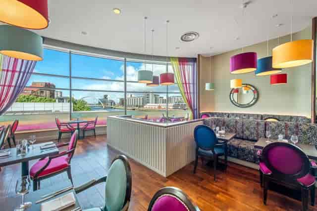 Waterfront Restaurant private dining room with floor-to-ceiling windows for networking events.