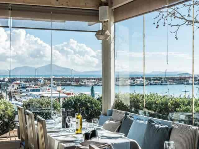 High-end waterfront restaurant lounge for corporate luncheon or VIP networking event.