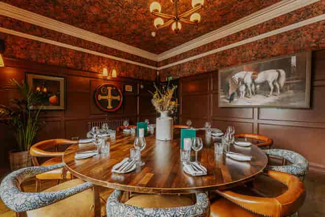 Private dining room at Sheesh Mayfair with circular table for intimate events and business meetings.