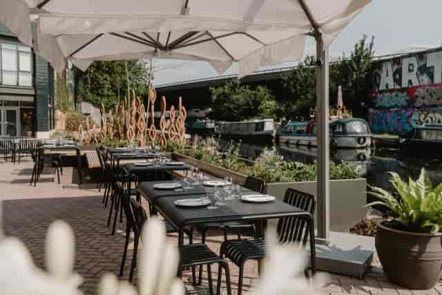 Canal-side terrace at The Union Paddington: industrial outdoor space for networking and events.