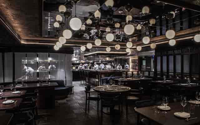 Private dining room with statement lighting for executive dinners and corporate events in Mayfair.