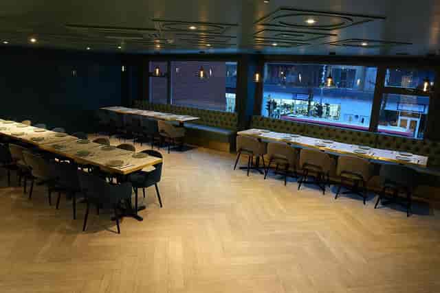 Private function room at Breeze Highams Park with banquette seating for dinners and corporate events.