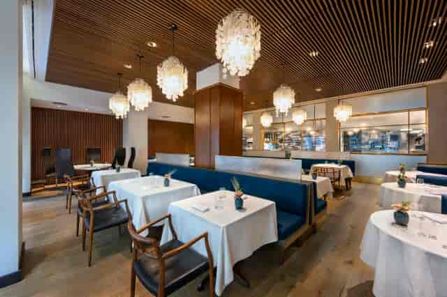 Upscale restaurant lounge with banquette seating for VIP dinners and corporate networking events.