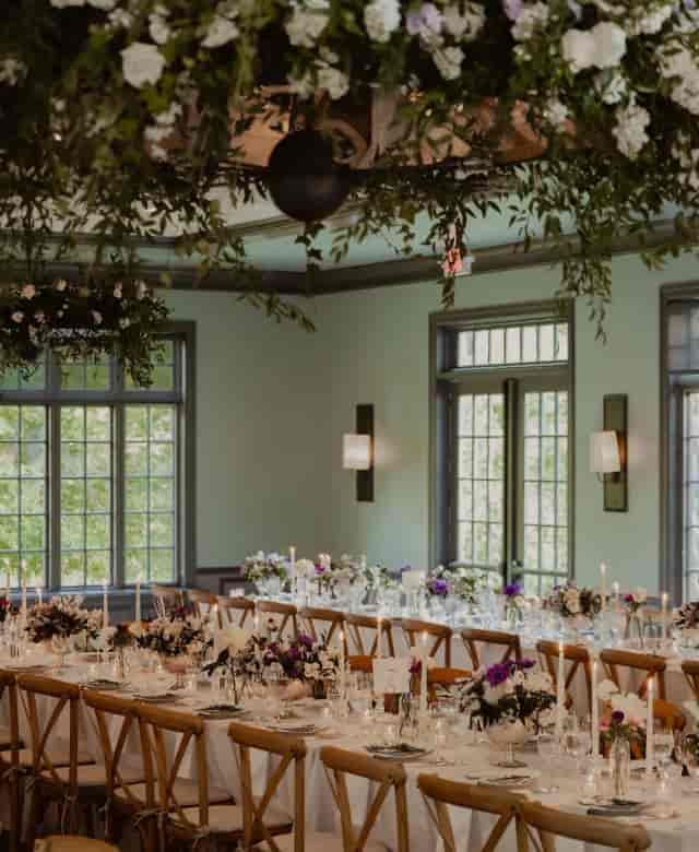 Aquavit restaurant buyout event space with greenery decor for romantic private dining.