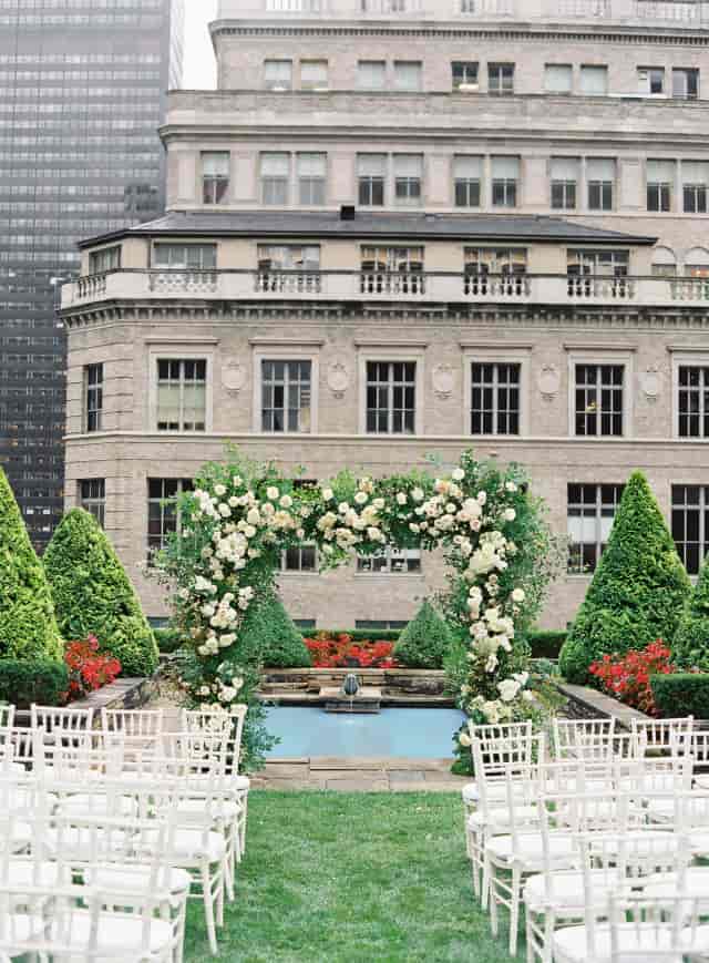 Floral arch at The Times Square EDITION outdoor wedding venue and gala event space.