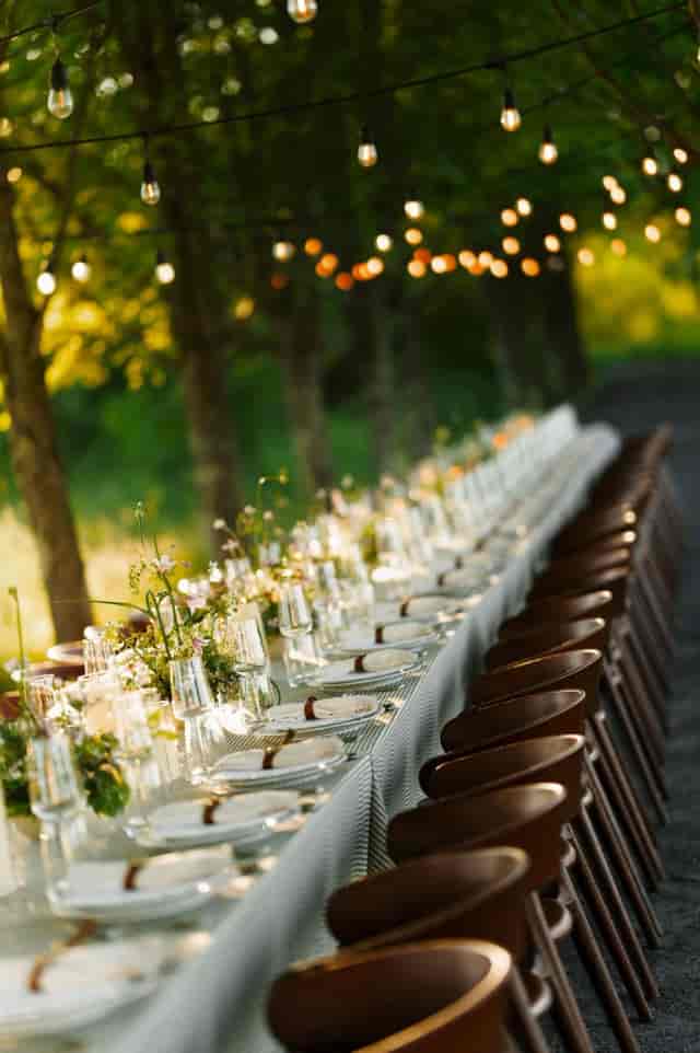 Times Square EDITION terrace, long-table alfresco setup for luxury corporate event or wedding.