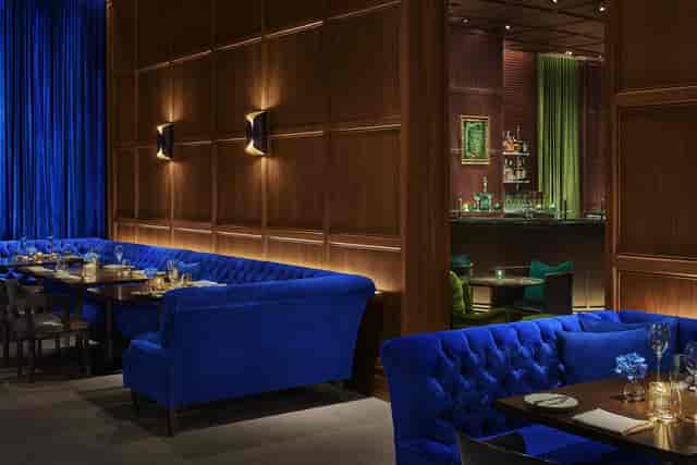 701WEST VIP corporate reception lounge with blue velvet seating for luxury networking events.