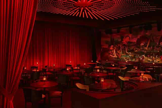 Paradise Club venue with red lighting for VIP receptions and awards galas.