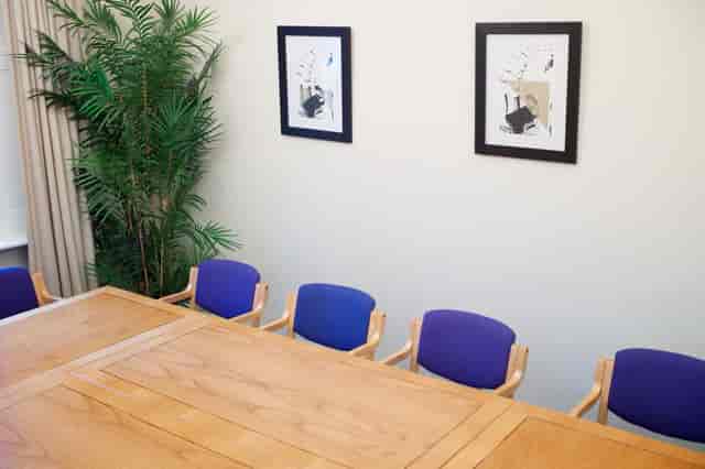 Atlay Room in St Matthew's Centre: large wooden table, ideal for meetings and events.