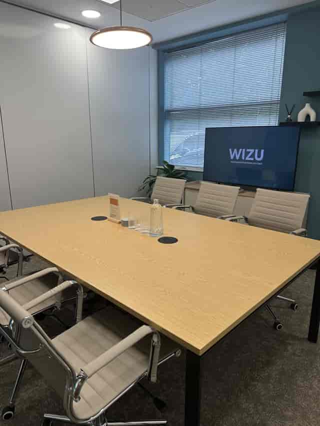 Pilot Suite boardroom at Wizu Workspace with AV tech, ideal for professional meetings and events.