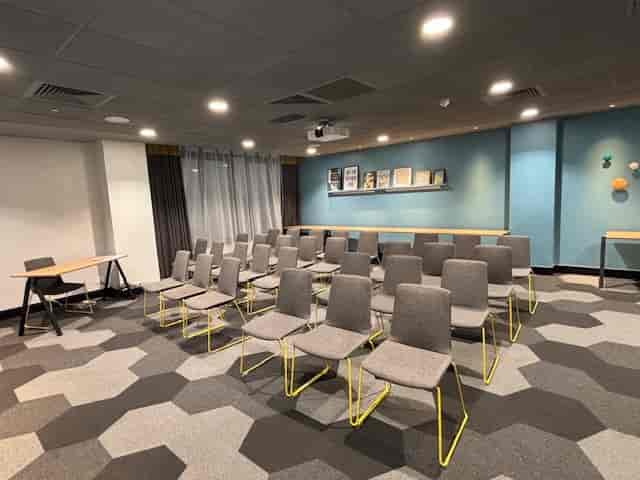 Aldgate Suite theater-style meeting room for corporate workshops and training sessions.