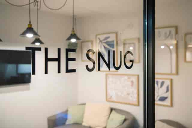 PCS Snug at Flexico Workspace: Cozy breakout room for private strategy sessions and interviews.
