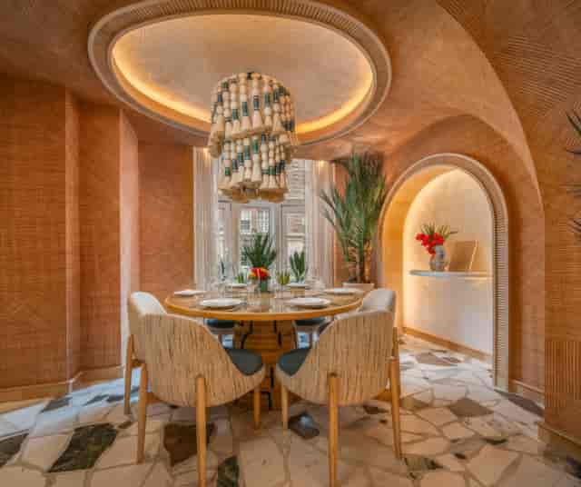 Luxury private dining room with statement chandelier for corporate events and VIP board dinners.