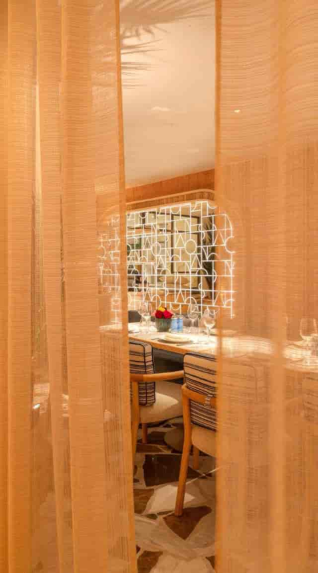 Semi-private dining room with elegant drapery for VIP corporate events and luxury hospitality.