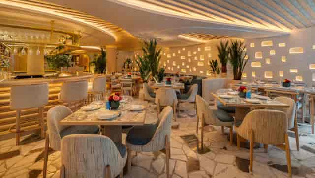 Exclusive venue hire at NAMMOS London: elegant corporate dinner and networking event space.