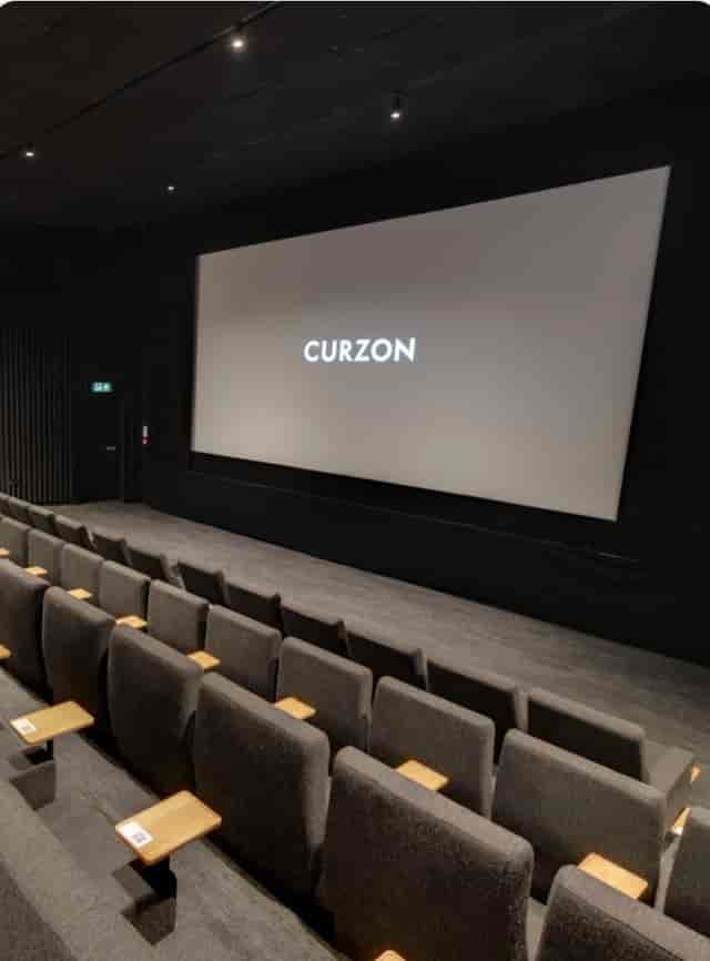 Modern Curzon Chelsea main stage, tiered cinema venue for corporate presentations and screenings.