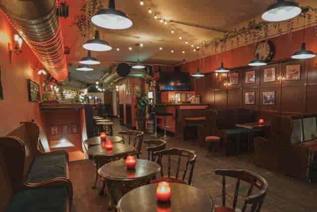 Cozy T-Bird Main Bar with booth seating for private events and networking.