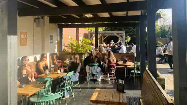 Conservatory at Red Lion: Versatile outdoor event space with golden hour lighting for networking.