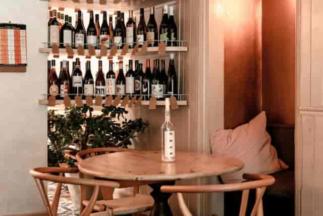 KASK Wine Bar, cozy indoor garden: intimate breakout session and upscale networking venue.