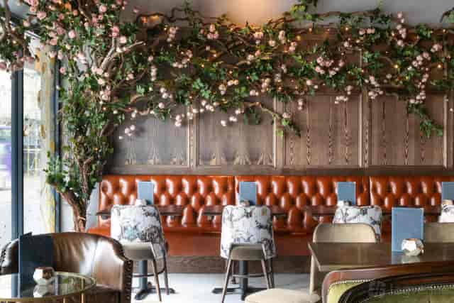 Upscale venue with floral decor for corporate mixers and private dinner events.