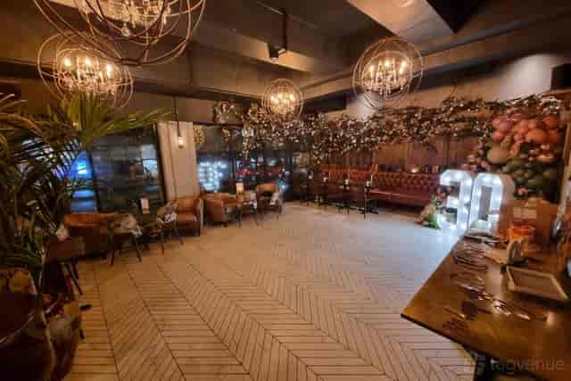 The Lost & Found industrial venue with floral decor for milestone celebrations and private events.