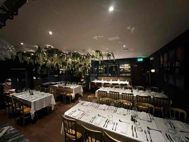 Private event space at The Lost & Found with floral decor for corporate dinners and social parties.