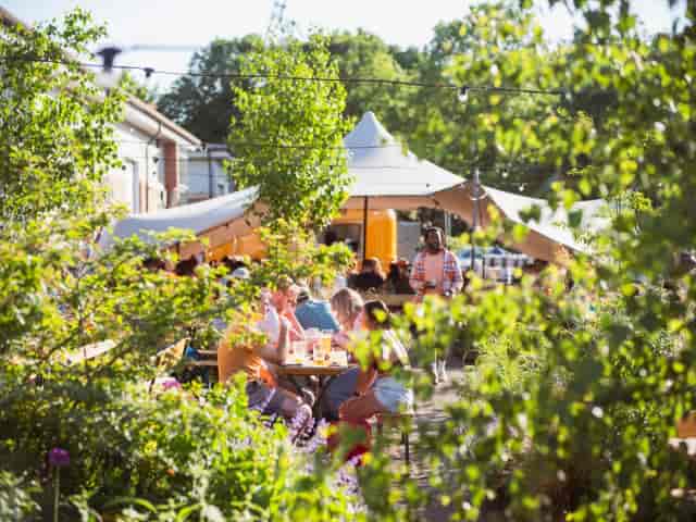 Wiper and True taproom venue with stretch tents and communal seating for outdoor networking events.