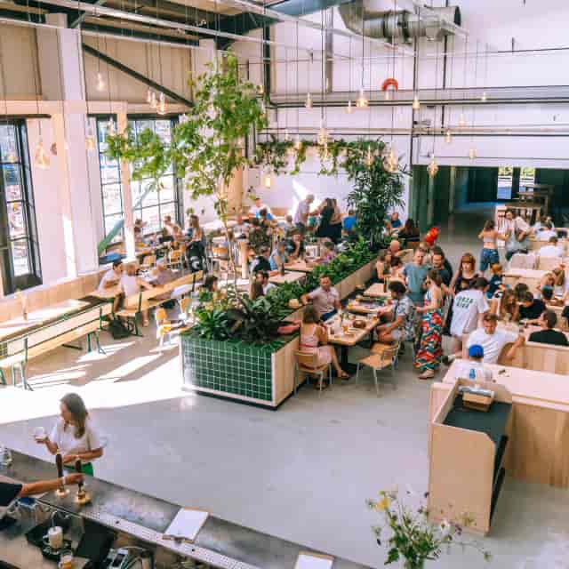 Wiper and True private event space with modular bench seating for networking and social gatherings.