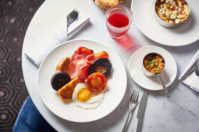 Full English breakfast plate at EVA, ABode Manchester for event catering and networking.
