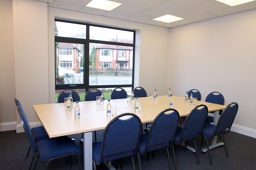 Elliot Room at The LifeCentre: bright meeting space with blue chairs for workshops.