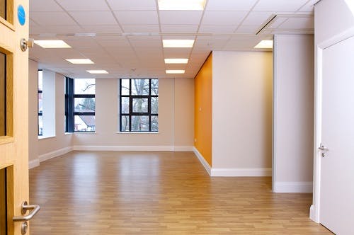 Luther King Room: bright event space with orange accent wall for meetings and workshops.