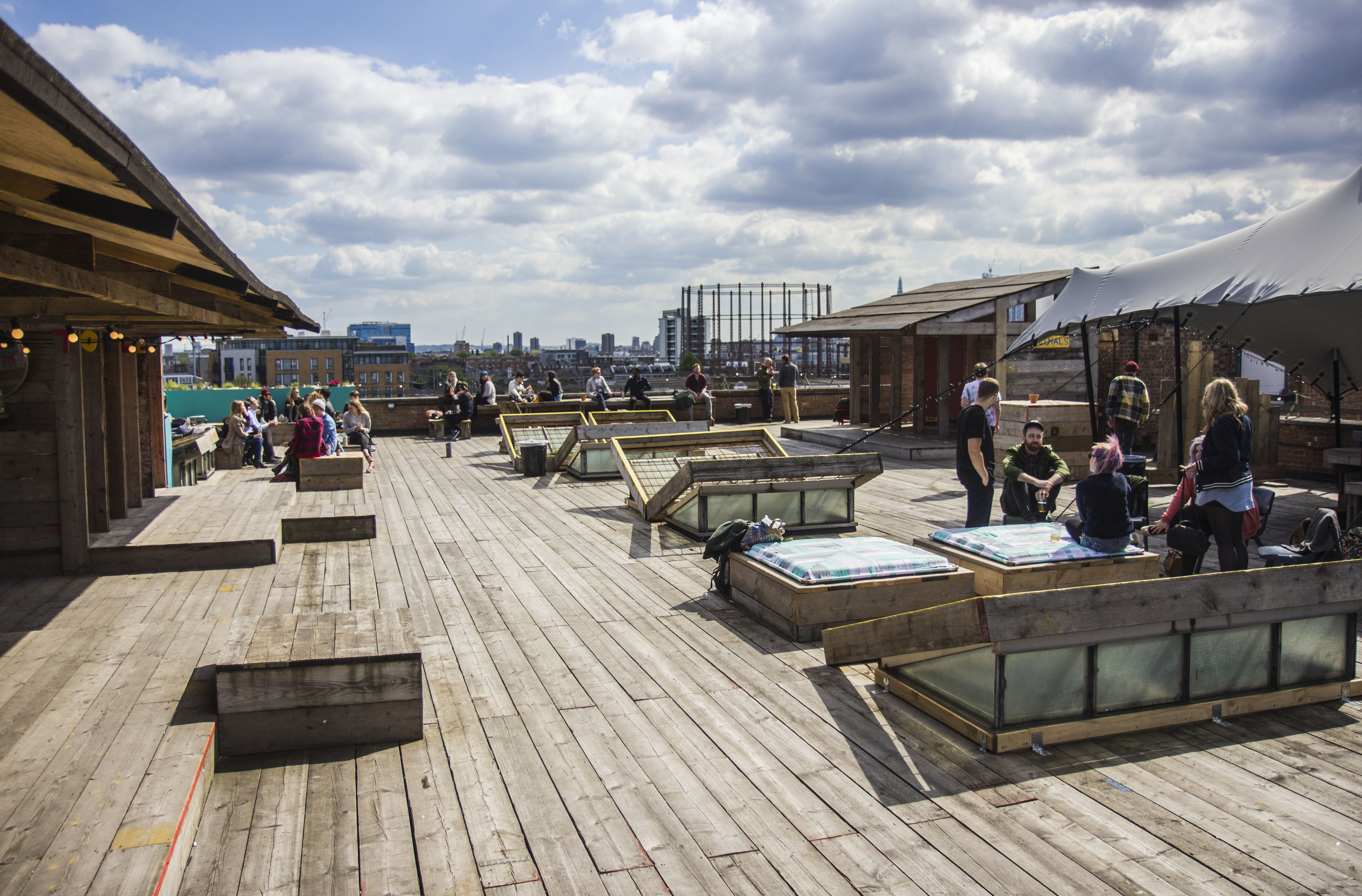 Rooftop garden at Netil360 Bar, featuring wooden decking for summer events and gatherings.