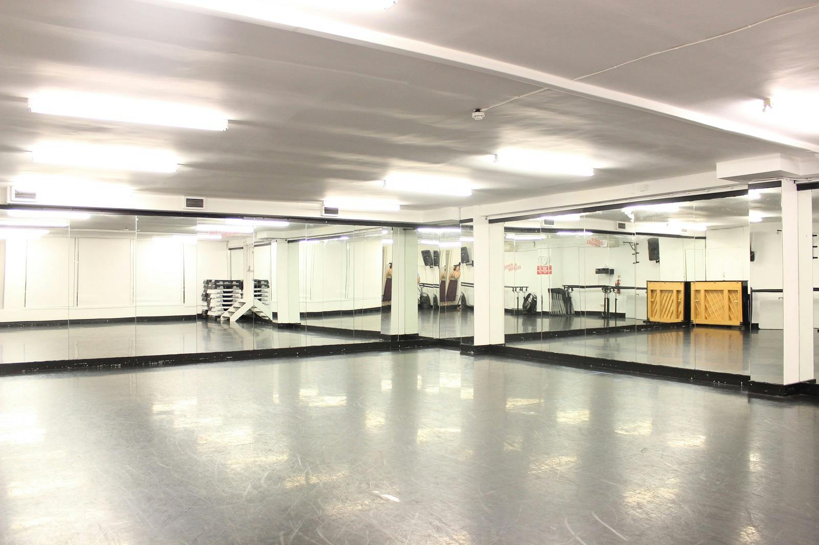 Spacious Danceworks Studio 11 with mirrored walls, perfect for workshops and dance classes.