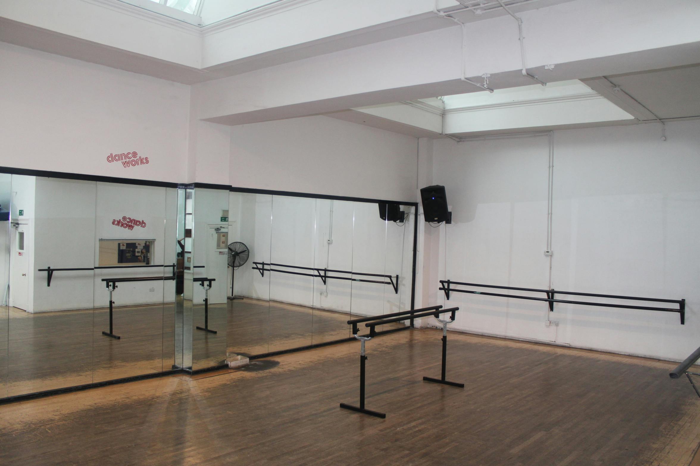 Spacious Danceworks Studio 1 with mirrored walls, ideal for fitness and dance workshops.