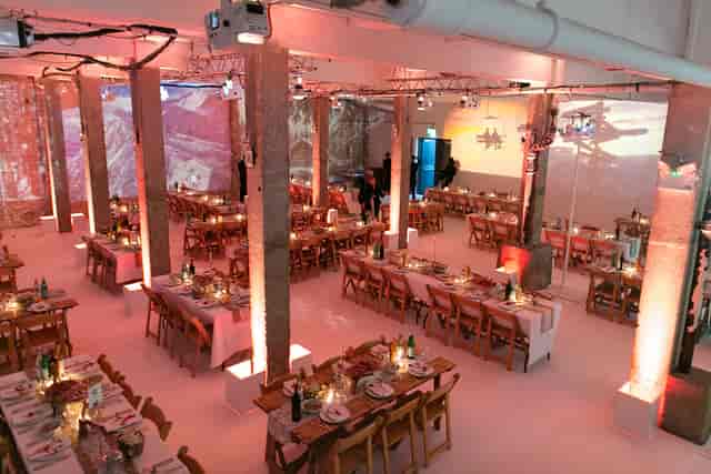 Elegant event space with long tables, ideal for networking and celebrations.