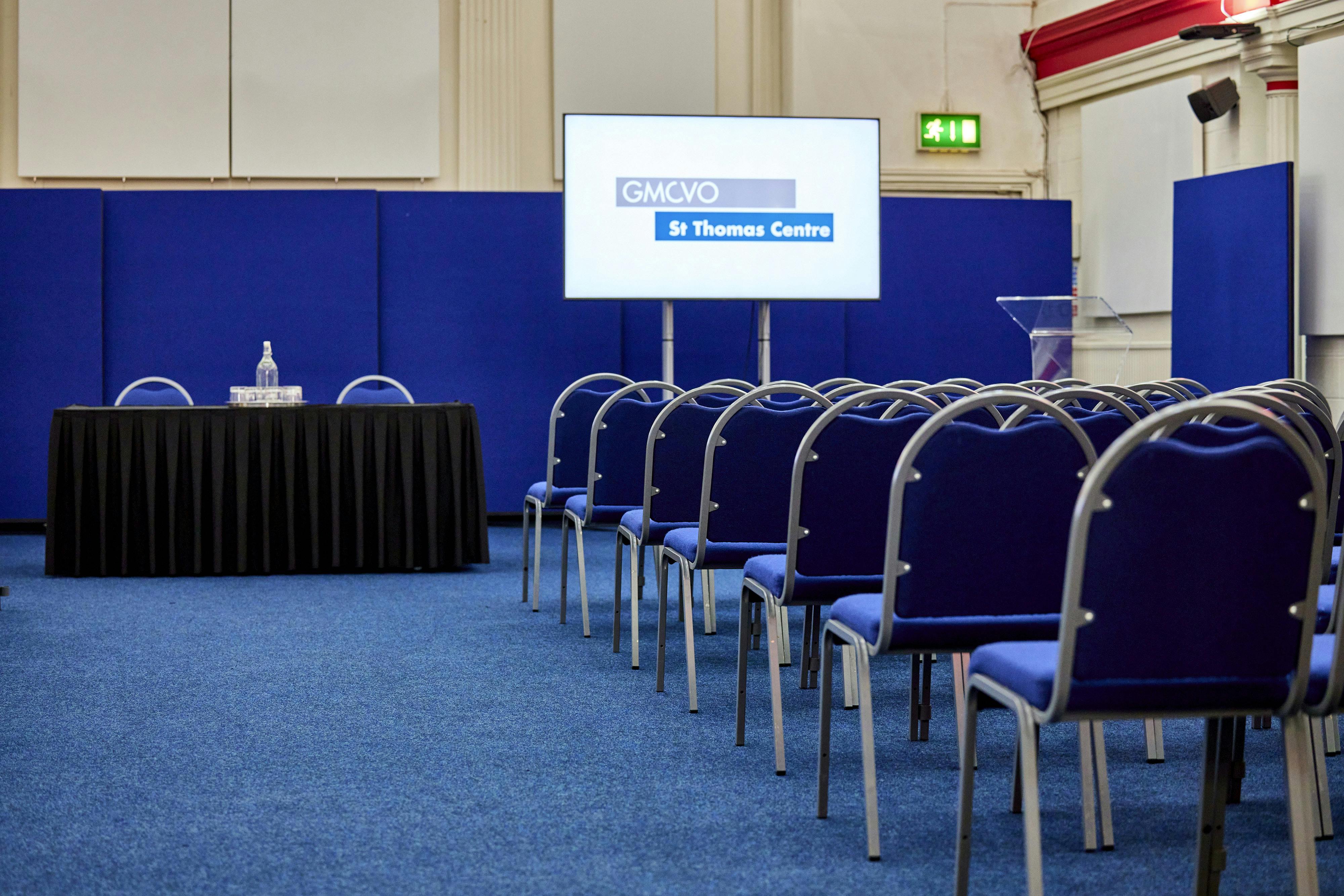 St Thomas Centre meeting space with presentation screen, ideal for corporate events.