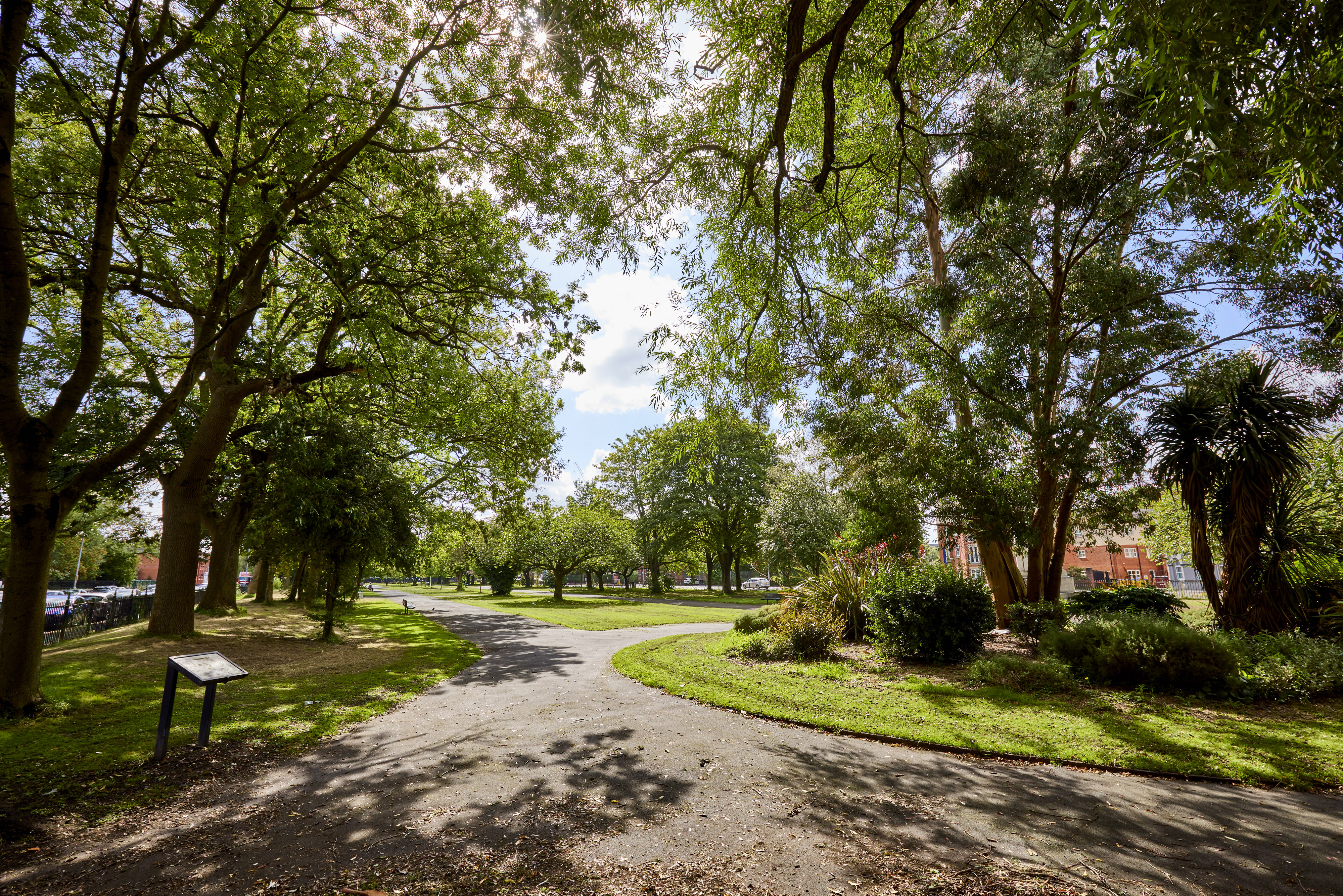 St Thomas Centre park with lush greenery, ideal for outdoor events and team-building activities. - Banner