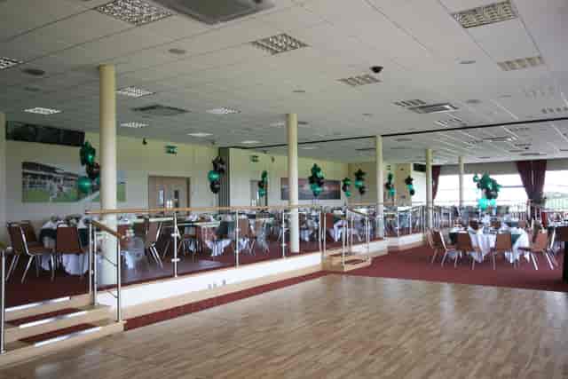 Spacious Park Suite venue at Haydock Park, set for formal events with elegant decor.
