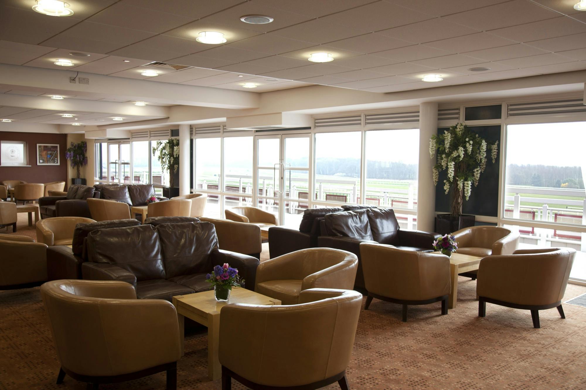 Premier Suite lounge at Haydock Park Racecourse, spacious for networking and events.