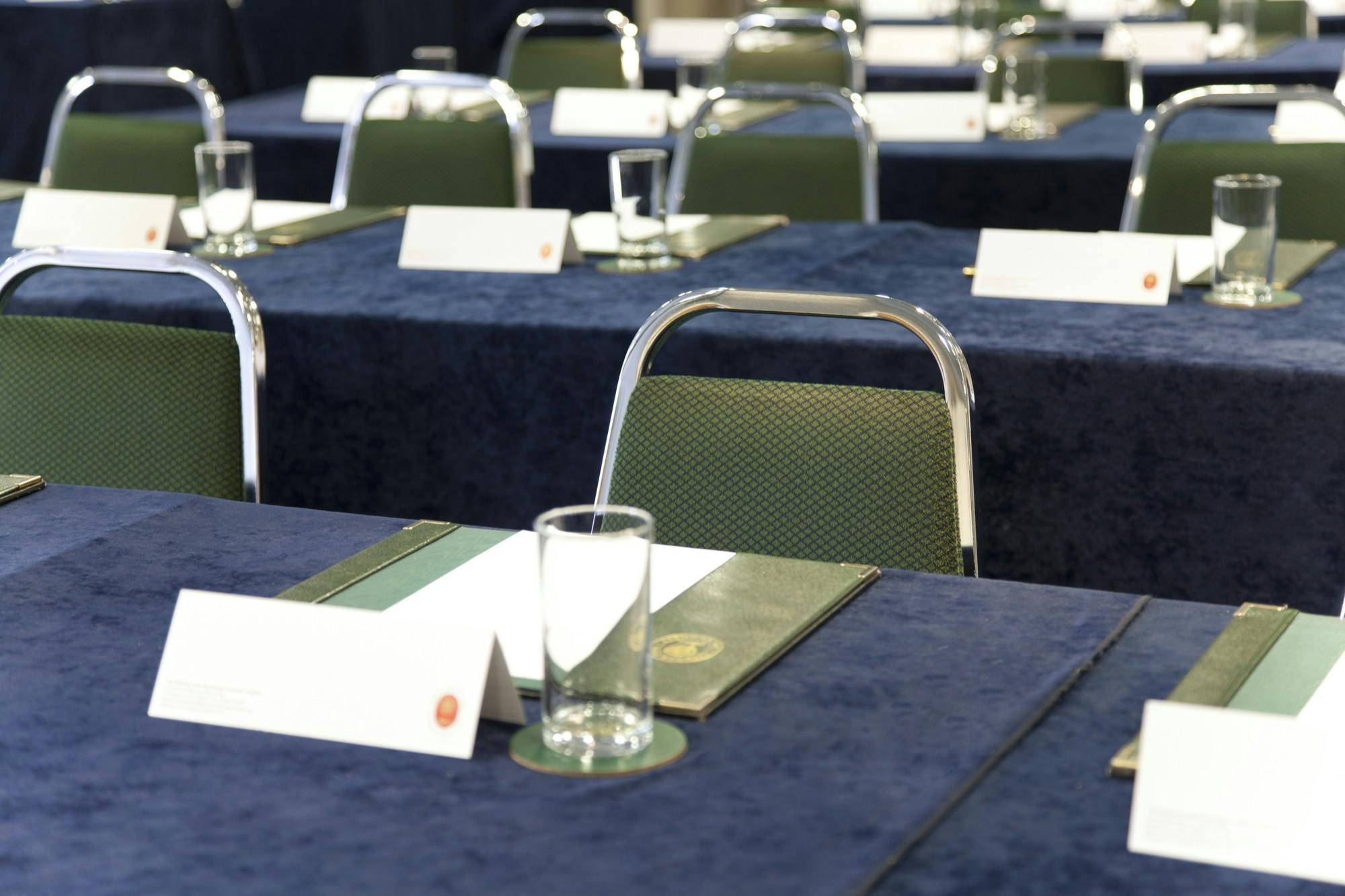 Lancaster Suite meeting setup at Haydock Park Racecourse with blue linens and place cards.