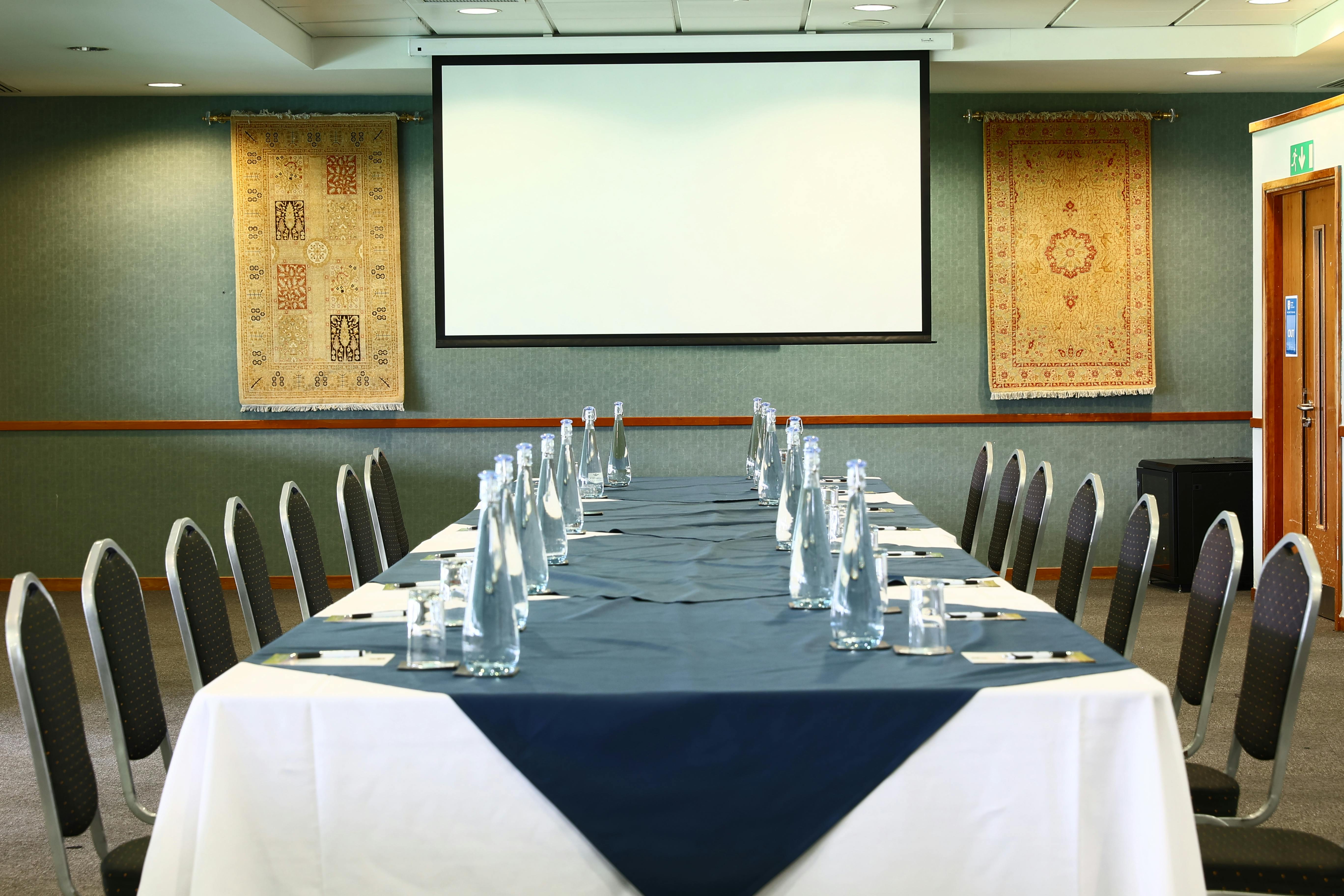 "Pakistan Room at Kia Oval: professional meeting space with elegant decor and presentation screen."