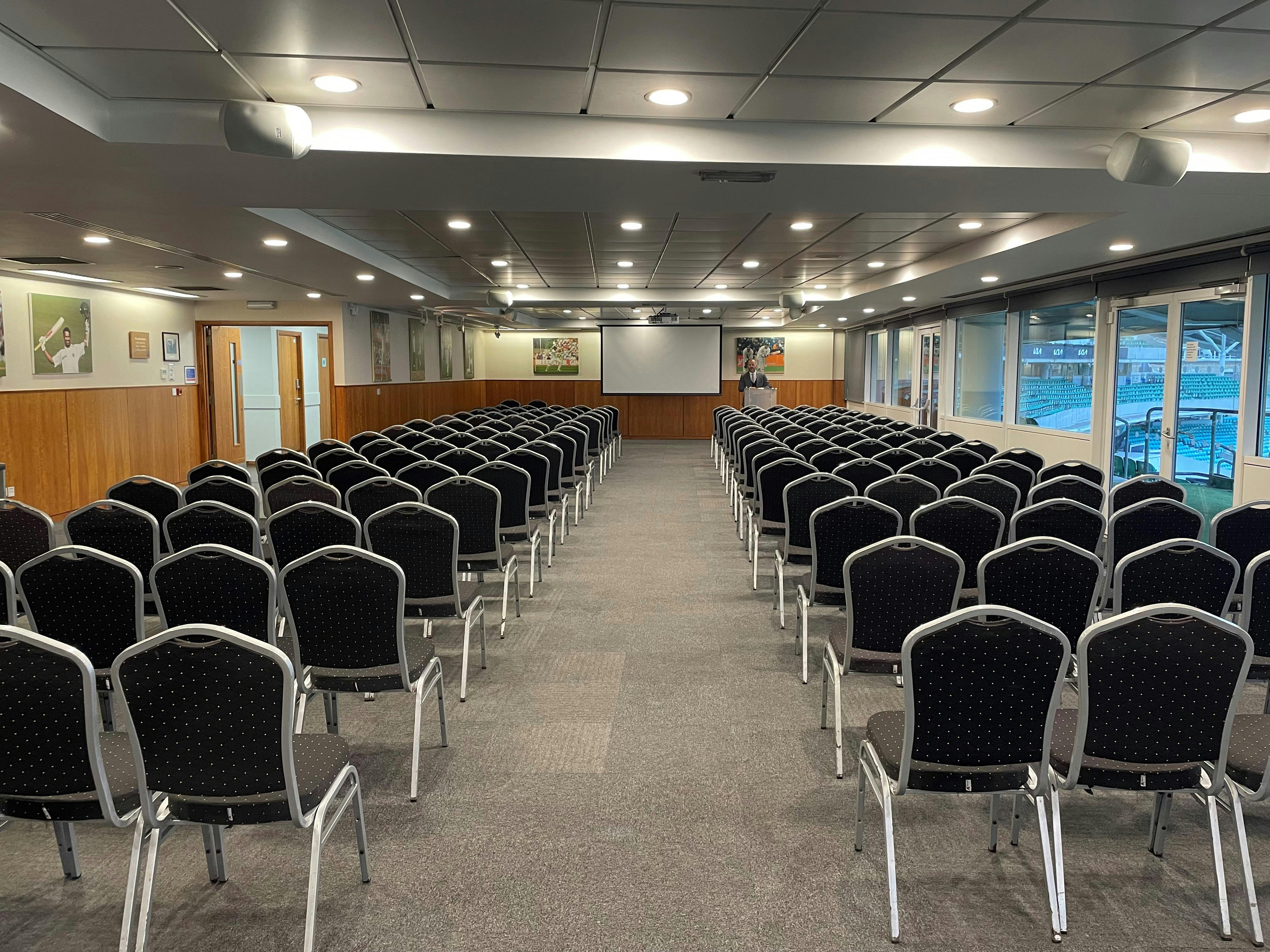 India Room at Kia Oval: spacious meeting space with black chairs for conferences and seminars.