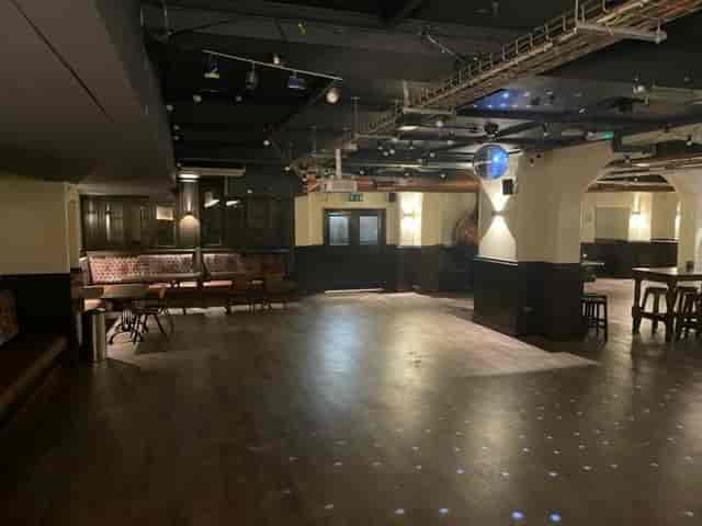 Versatile event space at Kimpton Clocktower Hotel with polished flooring for gatherings.