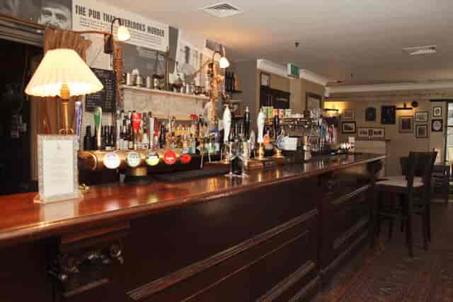 Magpie & Stump bar area with warm lighting, ideal for networking events and gatherings.