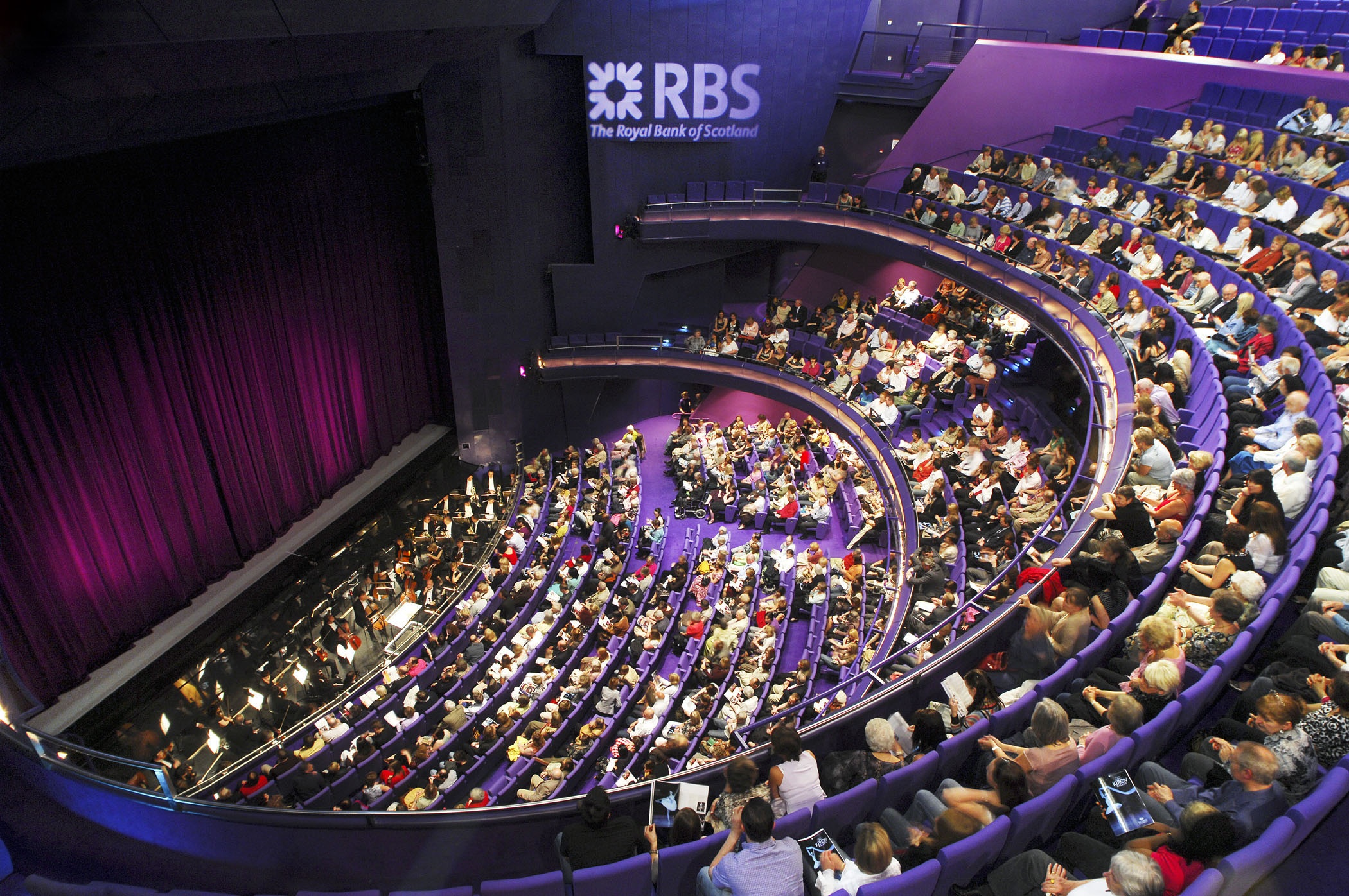 Lyric Theatre auditorium with tiered seating for engaging events and professional productions. - Banner