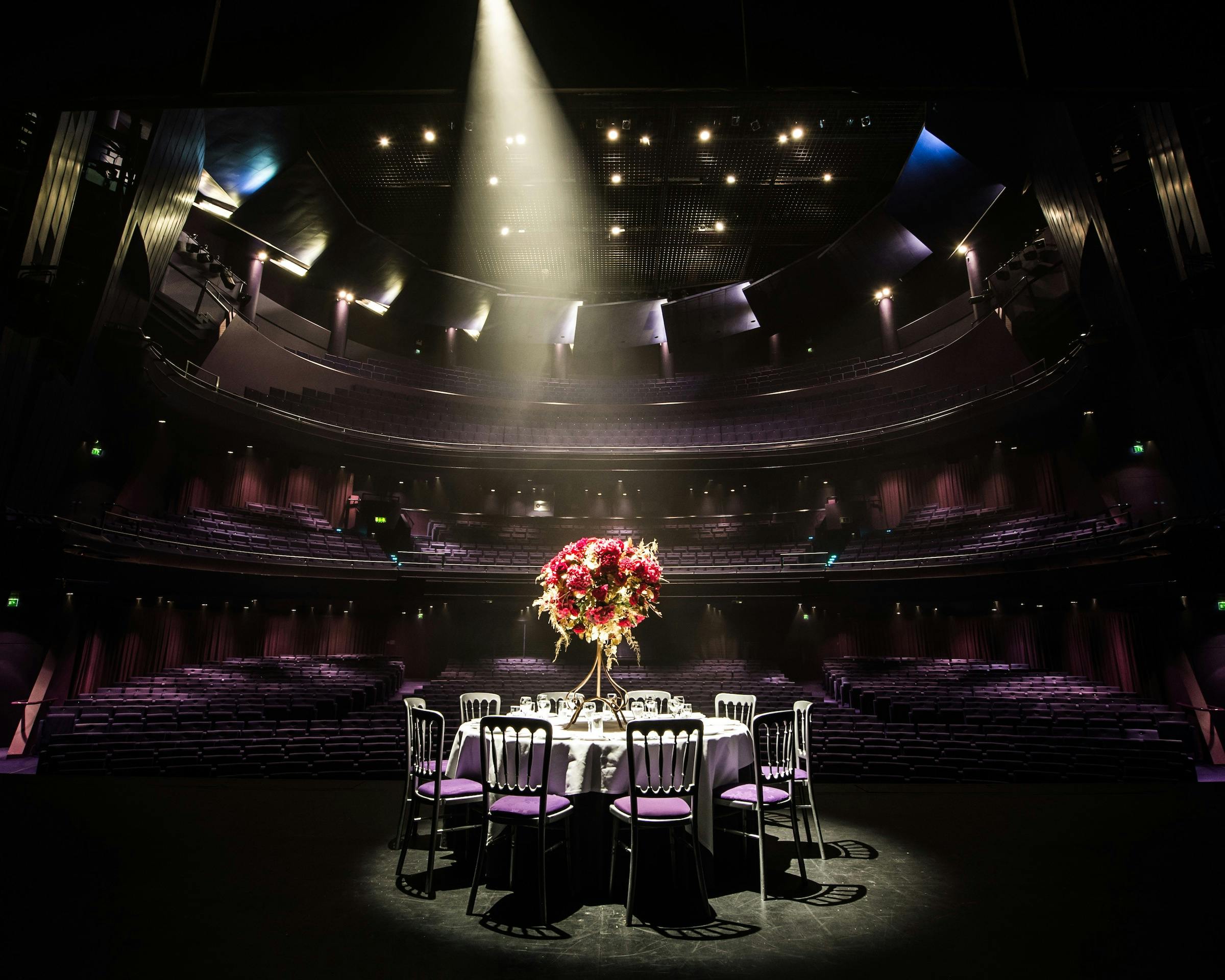 Elegant table with floral centerpiece at Lyric Theatre, The Lowry for upcoming event.