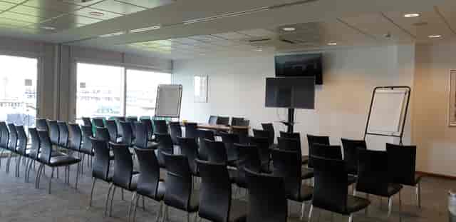Double Executive Box at Kia Oval, featuring black chairs for meetings and presentations.