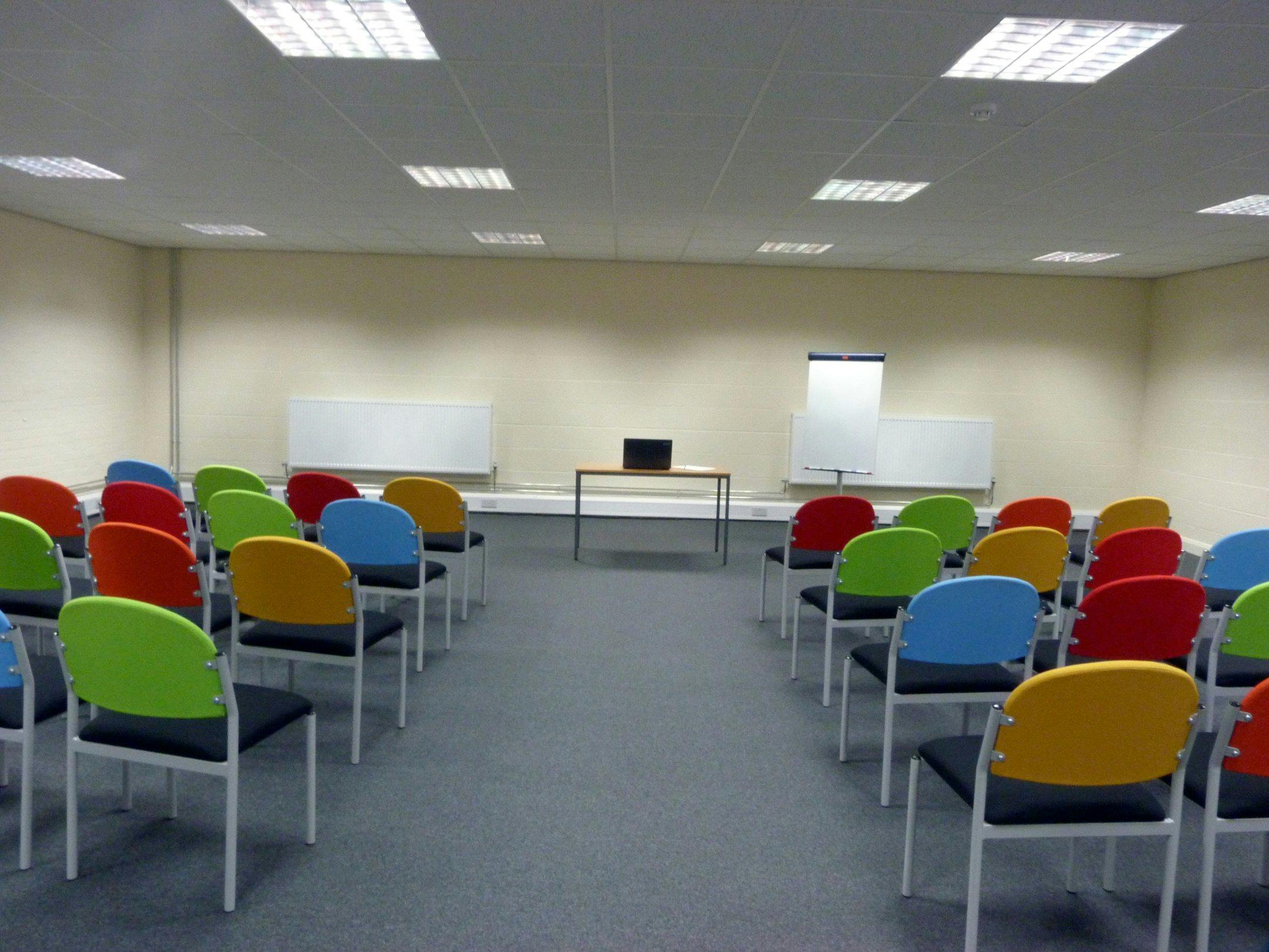 Training Room 2 at Redbank House, featuring colorful chairs for workshops and presentations.