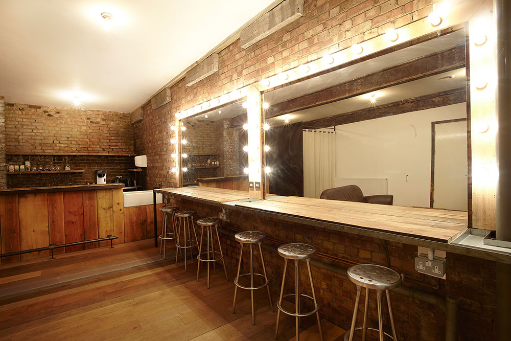 Stylish Canvas Works venue with exposed brick, perfect for networking events and gatherings. - Banner