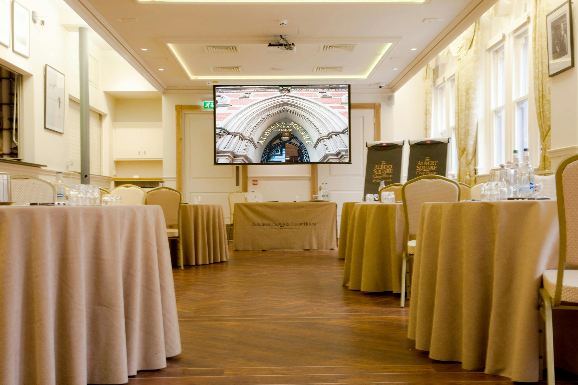 Memorial Hall meeting space with elegant tables, ideal for corporate events and workshops.